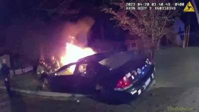 Body cam footage captures Lansing police officer pulling 3 people from a fatal burning car accident