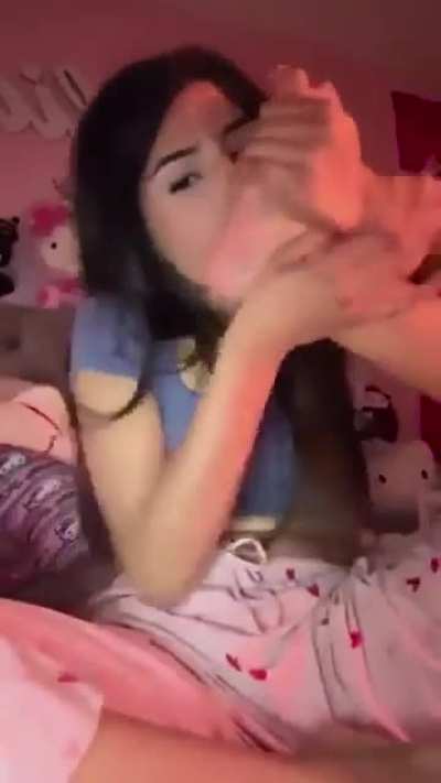 Girl in hello kitty sucking on her feet