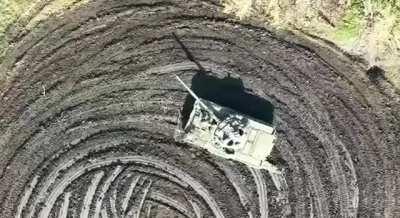 A Ukrainian drone dropping two precise grenades on a Russian tank crewman.