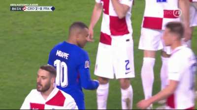 Luka Modrić stops Mbappé's drive on goal and lets his club teammate hear about it