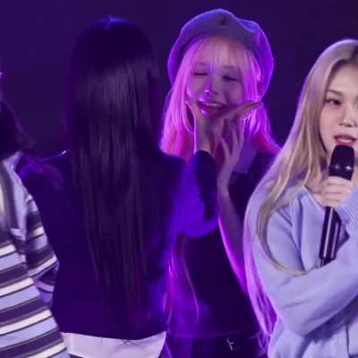 Jiyeon gets distracted by the Strawberry Aliens cuteness during a performance