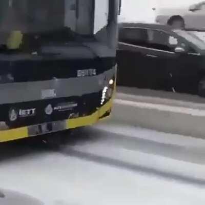 Bus drifting in snow