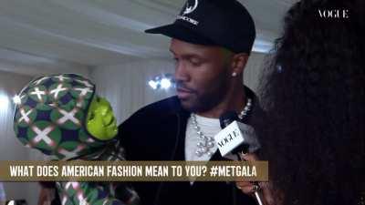 Frank at the Met Gala with a robot baby