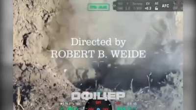 Ukrainian Drone drops a grenade into a russian dugout, a russian soldier throws it out but it rolls back in and explodes. September 2025.