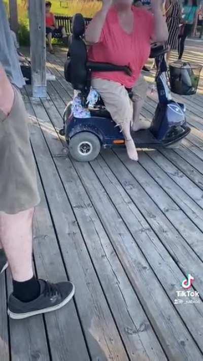 Racist Karen on a scooter being an asshole to everyone in sight in Canada