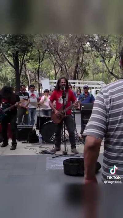 Old folks dancing to metal music in the park