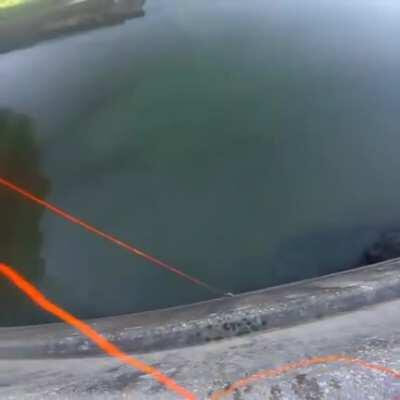 Bowfishing from a dam.