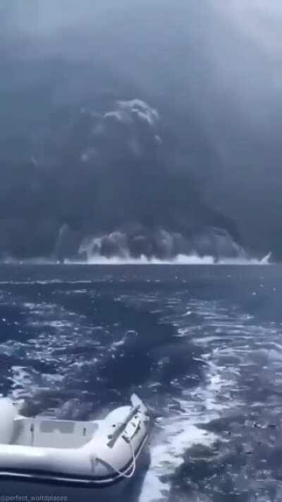 Sailing away from a volcanic eruption in Italy