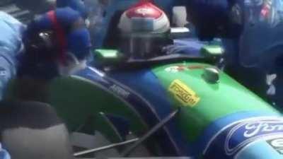 A race car makes a pitstop.