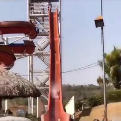 Swimming in front of the end of a waterslide