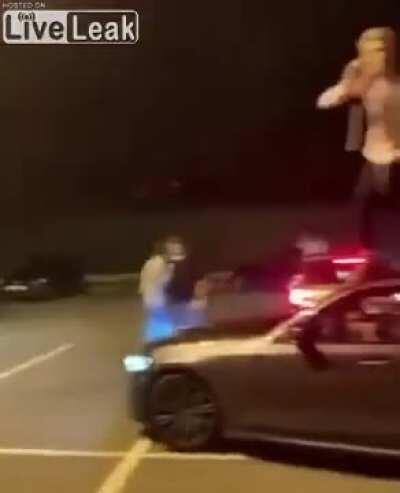 Man Jumps off Roof of Car and Lands on his Balls