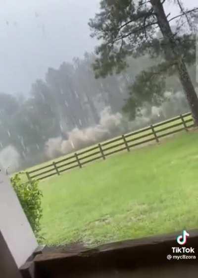 This woman was able to film lightning and keep recording.