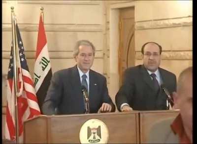 Bush dodges flying shoes