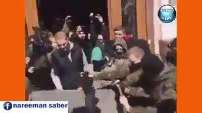 Ukranian protesters throwing corrupt politicians in garbage bins