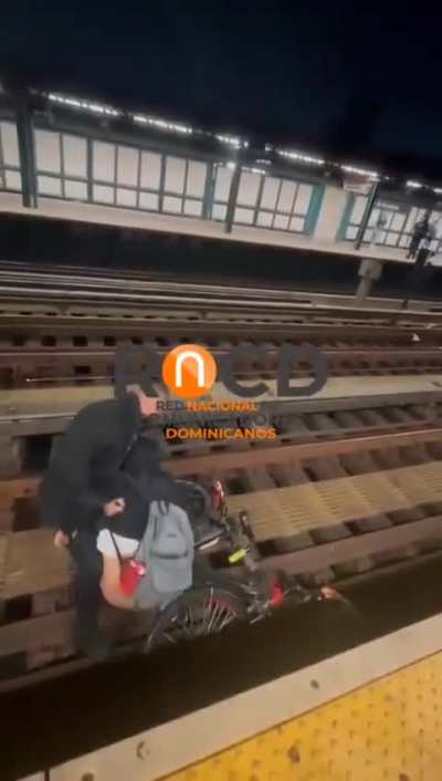 Delivery man who fell onto the subway tracks gets rescued by a good Samaritan.