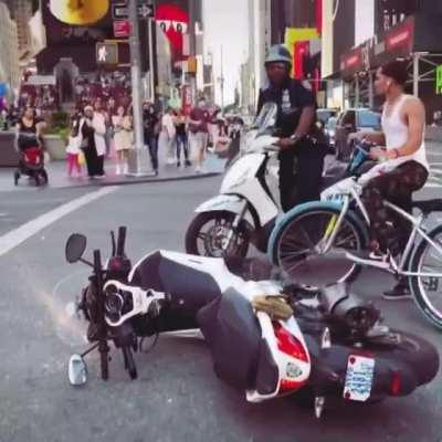 Crashing into an NYPD officer while you do a wheelie