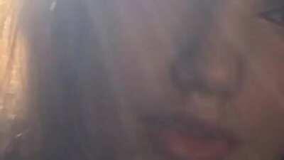 Sticking her tongue out