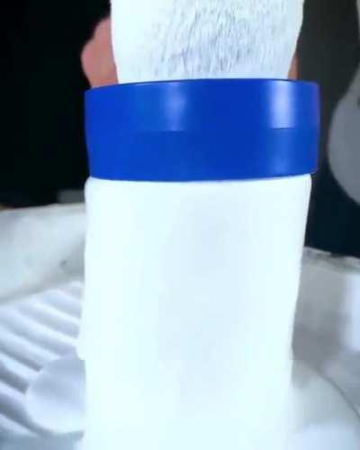 This paint roller being cleaned