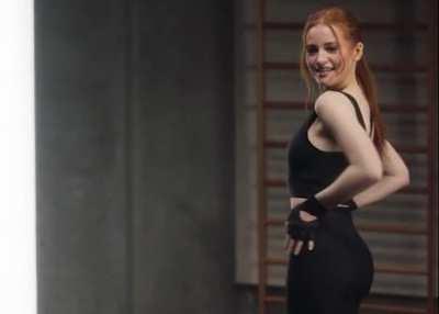 Madelaine Petsch being distracted by her own body.