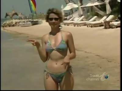 Samantha Brown (travel channel host) bouncing out of frame in a string bikini