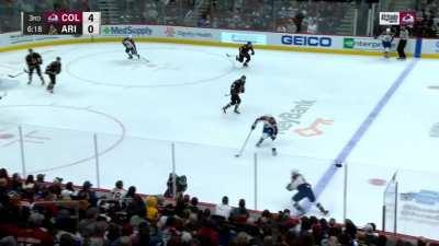 Cale Makar running over a Coyote