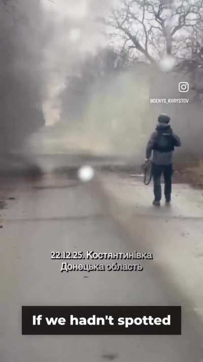 UA POV: Volunteers Denys Khrystov (known as “The Dutchman”) and Bogdan Zuyakov destroy a drone that had landed on the road while they were en route to an evacuation.