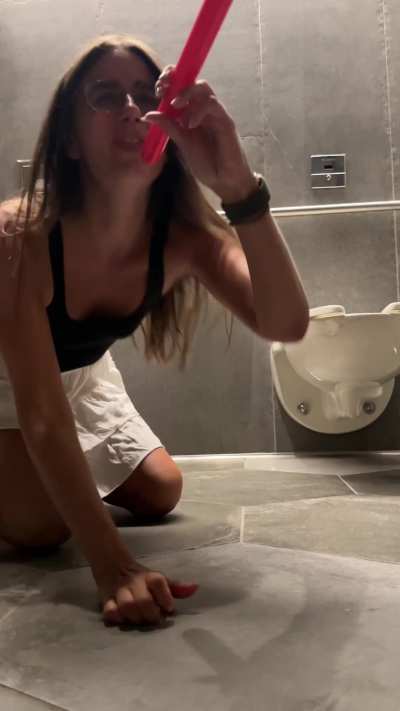 She takes a lightsaber in a public restroom