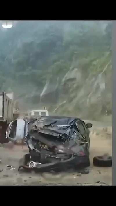 Giant Rock Hits Vehicles on Road in India