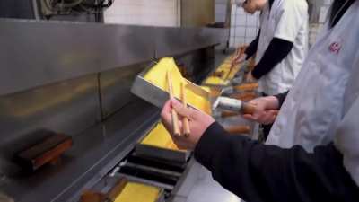 5AM at a Tamagoyaki (Japanese rolled egg) specialist shop. Looks simple but the guy tells me it took everyone about 3 years to learn the technique - but that's not the end of it. They could do this their whole life but they humbly admit there's no such th