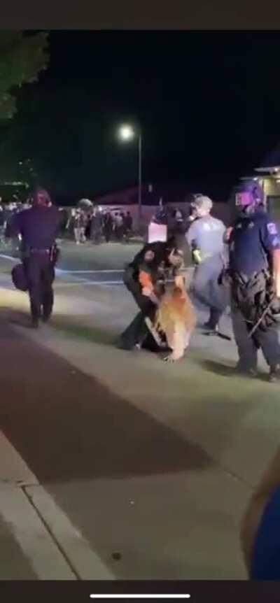 Cops violently arrest 14 y/o girl, while ignoring Proud Boy who punches a teenager right in front of them. Eugene, OR