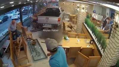 An idiot crashing into a restaurant with his car