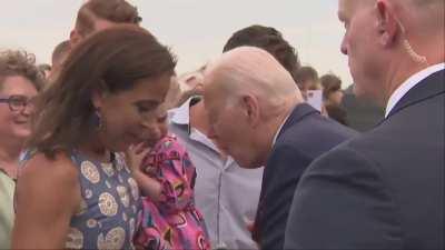 Biden attempts to eat a child? 😖