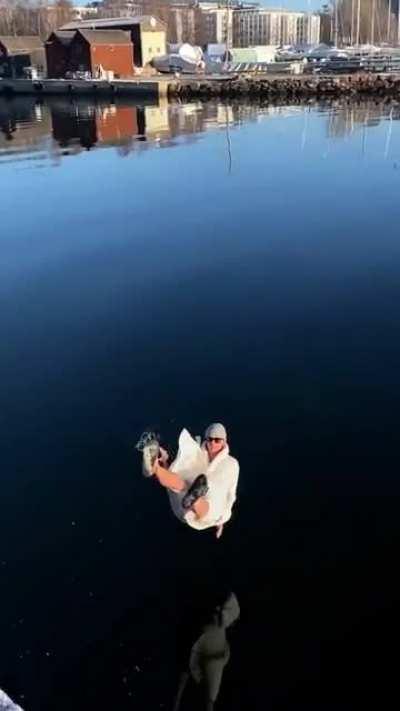 Dramatic slide into the water with the sun beaming