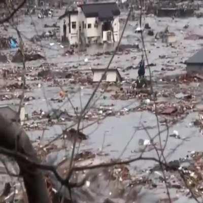 Tsunami sweeping away houses