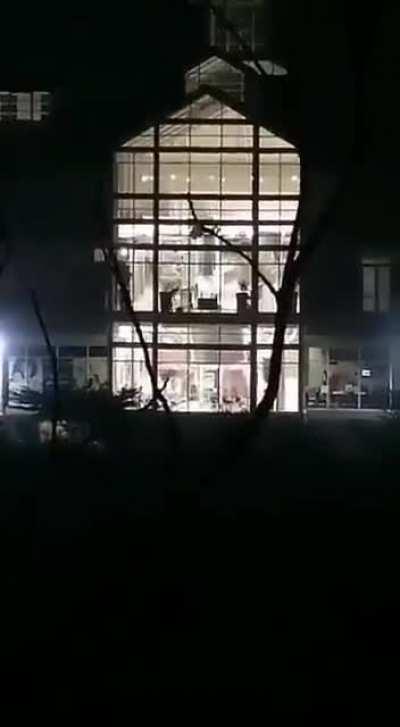 Looter falls from window