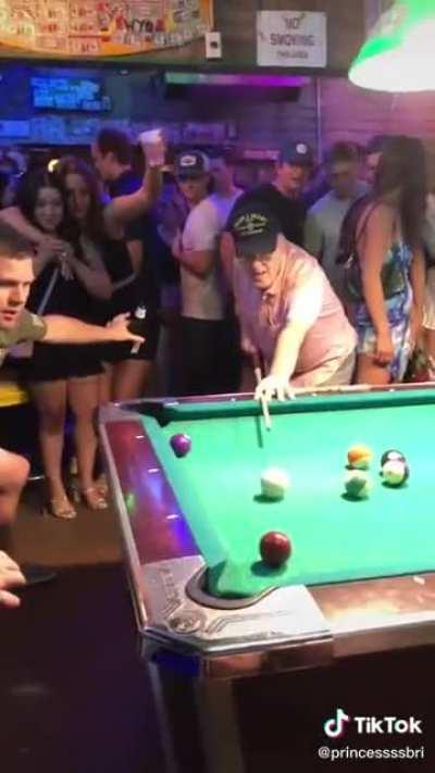 The main character of the night shows his pool skills
