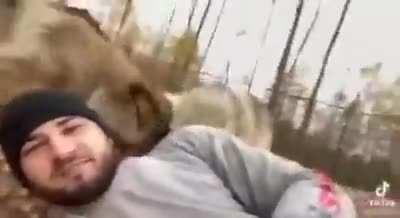 Man getting brutally mauled by a pack of dogs