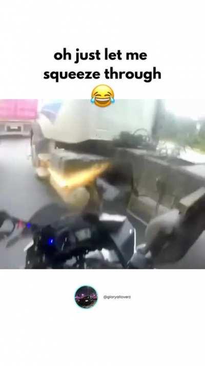 trying to squeeze your bike between two trucks