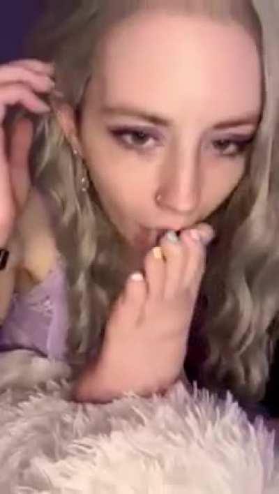 Using some spit as lube.