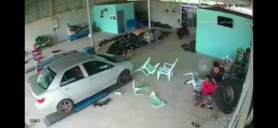 Runaway tire plows into a guy in his garage. Smashes the patio set too.