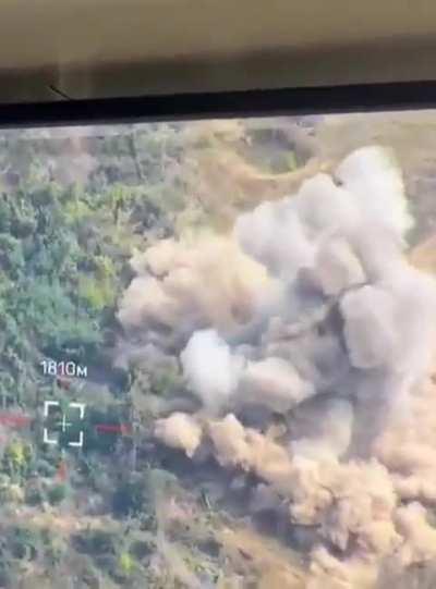 Ukrainian soldiers observing incoming missile strike (against target in bushes?) witness Russian soldier's ill timed stroll into missile blast zone. No info on location