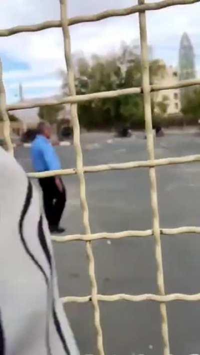 Security Guard shielding students from gunfire