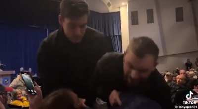 Woman forcibly dragged out of Republican town-hall by unidentified security after asking a question