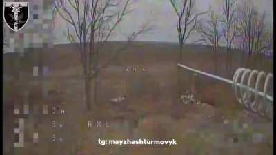 A Ukrainian FPV pilot from the 2nd battalion of the 128th Mountain Assault Brigade attacks a Russian field ammunition depot with his quad. 