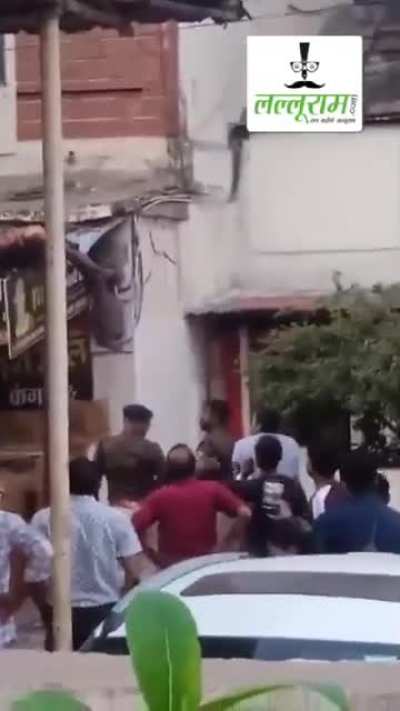 Man jumps from 3rd floor, gets entangled in electric wires, fall and then miraculously gets up to throw brick at police