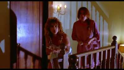 Evil Toons (1992): girl in white satin shorts and robe eaten