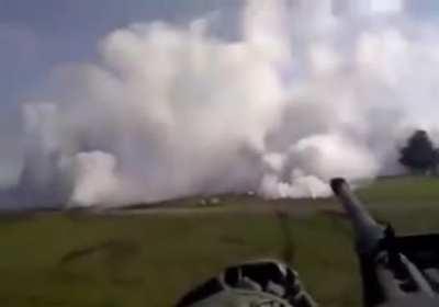 Tank deploys smokescreen.