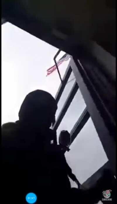 Man goes into a police station with a gun because he got pulled over and got scared.