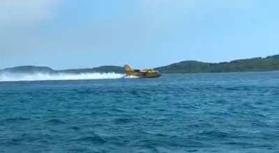 Live from Croatia: Air tankers flying very close to the beach to pick up the water for nearby fires 🔥