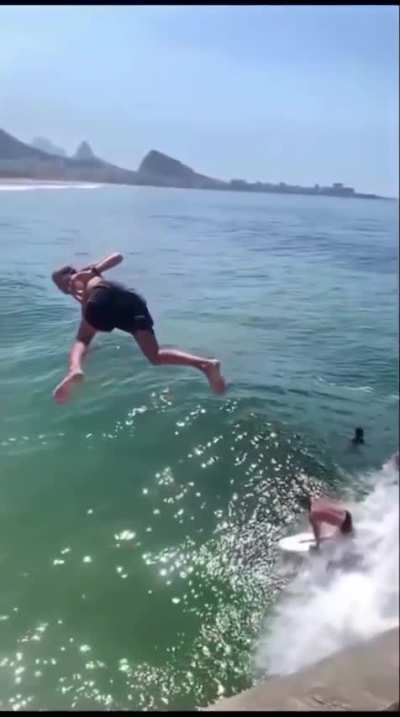 Diver does a heart emoji to the camera in mid air